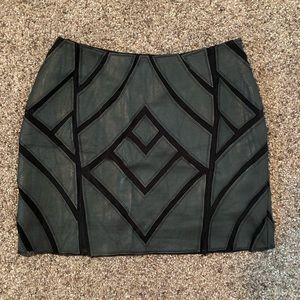 Black leather and mesh mini skirt